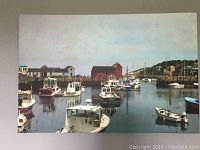 Front view of the 24" x 30" canvas print showing boats docked in the harbor with buildings in the background.