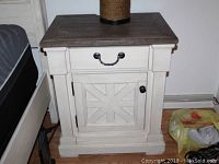 Full front view of nightstand showing overall design, finish, drawer and cabinet