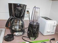 Photo showing all three small kitchen appliances: coffee maker, blender, toaster.