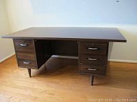Front view of High Point Desk Industries executive desk showing two drawer pedestals and broad top surface