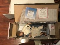 Ashton Drake gallery doll seated in original packaging, with certificate and paperwork included.