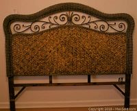 Full front view of the king size headboard showing rattan woven panel, wood frame, and metal accent.