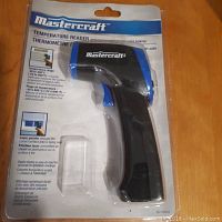 Front view of the Mastercraft temperature reader in packaging showing brand, product type, and features.