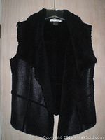 Front view of black faux fur women’s vest showing texture and style