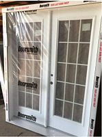 Front view of prehung double exterior garden door set in original packaging with protective film
