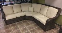Assembled three-piece wicker sectional with taupe cushions