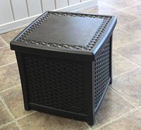 Photo of a dark brown woven design resin end table with storage, square shape and flat top surface
