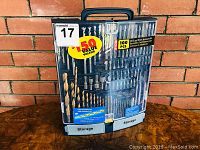 Photo of closed Ryobi drill and driver accessory kit case showing 100 pieces sticker and storage compartments.