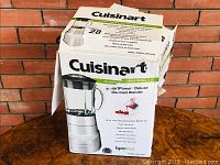 Original retail box for Cuisinart SmartPower Deluxe Die-Cast Blender Model SPB-600C, showing product image and features on white box with black and green print.