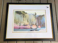 Framed watercolor print of a shoreline, showing the entire artwork and frame.