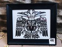 Frontal view of framed original drawing, showing full image with black frame and glass cover.