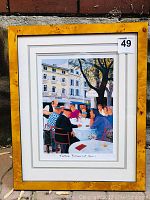 Framed limited edition print of people dining at a terrace restaurant in Cassis with walnut veneer frame.
