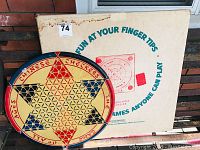 Chinese Checkers game board with Crokinole box behind, showing overall items in the lot