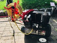 Full view of compressor, hoses and reel