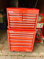 Full view of stacked top chest and bottom roller cabinet on caster wheels