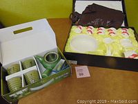 Photo of boxed green ceramic tea set with teapot and 6 cups