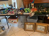 Photo showing a folding table used as a surface holding various household items and Christmas decorations.