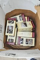 Seven Baldwin door knob sets in original boxes inside a shipping carton.