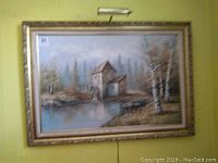 Full view of the large framed oil painting showing the watermill and surrounding nature including a river and trees.