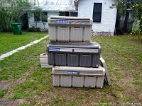 Three Deck Box coolers stacked outdoors, showing two large and one smaller unit