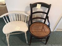 Photo showing a white wooden spindle back chair and dark wood caned seat chair side by side.