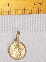 Front side of the pendant showing detailed Saint Christopher figure with child, next to ruler showing approx 12mm diameter.