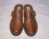 Top view of Eastland brown leather women's slides showing centered stitching and buckle detail