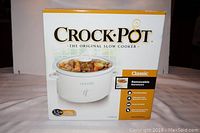Front view of new Crock-Pot box showing 3.5 qt capacity, classic model, removable stoneware, two heat settings, suitable for 4 people or 4 lb roast.