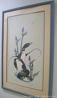 Framed 'Loon Dance' print showing the full artwork, mat, and frame