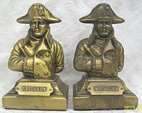 Front view showing two bronzed metal Napoleon Bonaparte bust bookends with name plaques