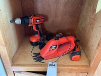 Photo showing drill, garden shears, and reciprocating saw on shelf