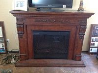 Frontal view of full fireplace and mantel