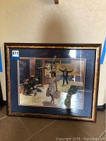 Full framed art print showing the entire image, frame and mat with visible signature.