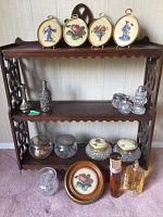 Full view of three-tier wood shelf loaded with all items