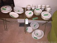 Full set arranged on two folding tables