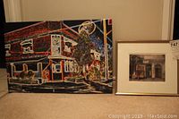 Canvas print featuring neon lights on Victoria Tavern in London, Ontario next to a smaller framed print of VG Barber Shop.