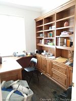 Front view of U-shaped desk with upper bookcases, wood veneer finish