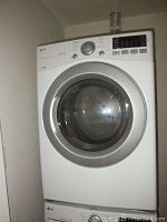 Front view of stacked LG dryer and washer showing doors and control panels