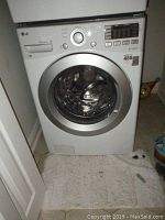 Front view of LG front-load washer showing door and control panel