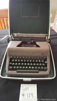 Vintage Royal Quiet De Luxe portable typewriter shown in its carrying case, open and ready for use.
