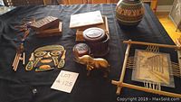 Full view of lot showing all included items on black cloth surface