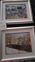 Two matted and framed hockey pictures stacked one on top of the other, visible silver wood frames, sizes approx 15x14 inches each