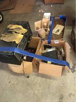 Packed lot with vintage radio, speakers, gloves, and receiver boxes