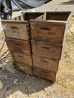 Two stacks of aged wooden fruit boxes with faded 'Mrs. E.J. Horn San Jose' stamps, showing front and side views.