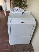 Front view of the Maytag electric dryer showing door and control panel.