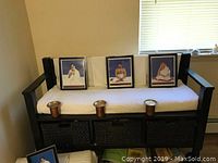Transitional solid wood arm bench with cushioned white seat and three basket storage underneath in espresso brown finish.