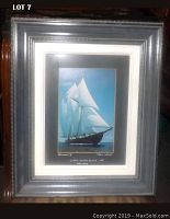 Full view of the framed photo showing the overall presentation including the silver-gray frame.
