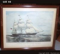 Full view of framed color print showing the British Clipper Ship Swiftsure sailing on water with fabric sails and flags. The print is in a dark wooden frame with glass.