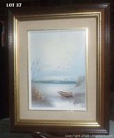 Framed mid-century oil painting showing a nautical scene with a boat, reeds, and birds under a soft sky.