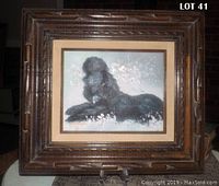 Full view of oil painting of black poodle in carved wood frame showing overall condition and size.